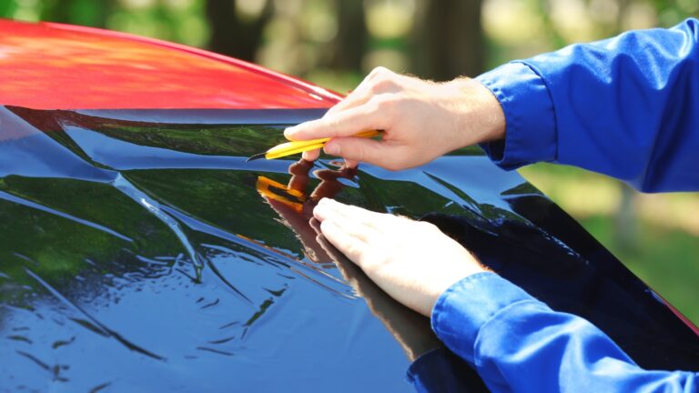 applying film to car windshield after Houston windshield repair
